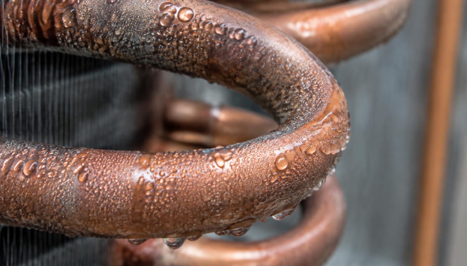 Condensation forming on a cold metal cooling coil
